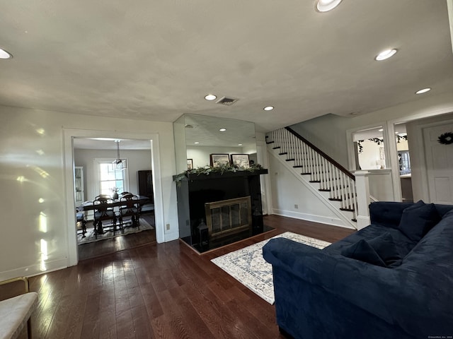 living room featuring dark hardwood / wood-style flooring