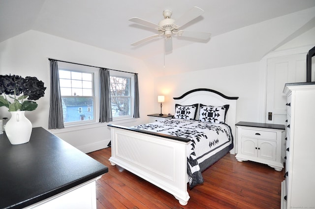 bedroom with vaulted ceiling, dark hardwood / wood-style floors, and ceiling fan