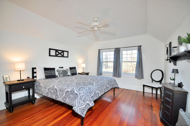 bedroom featuring lofted ceiling, wood-type flooring, and ceiling fan