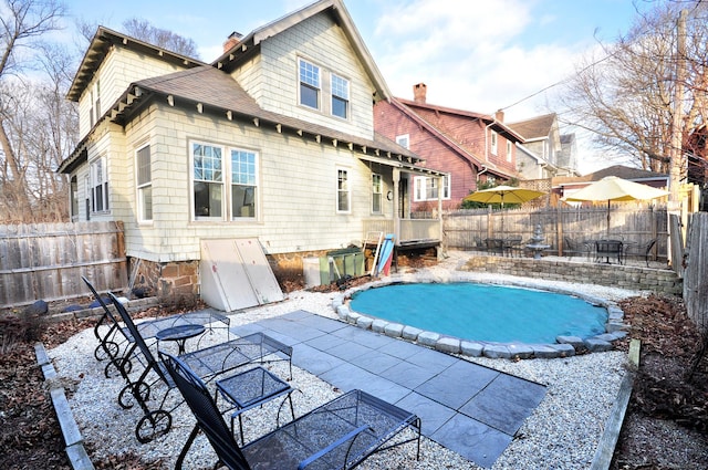 view of swimming pool with a patio area