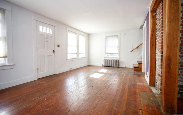 entryway with radiator and dark wood-type flooring