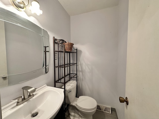 bathroom with sink and toilet