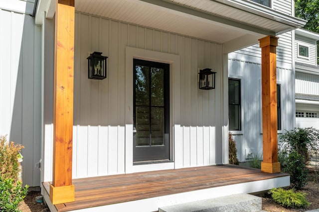 doorway to property featuring covered porch