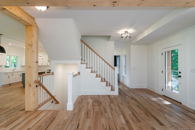 entrance foyer featuring sink and light wood-type flooring