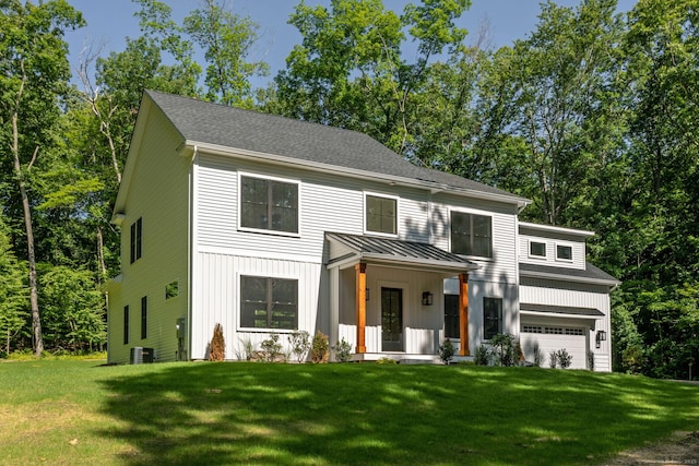 view of front of property featuring a garage, a porch, and a front yard