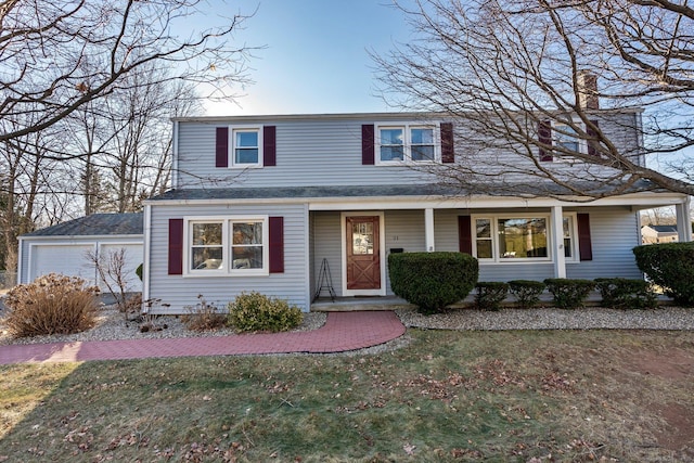 front of property with a front lawn and a garage