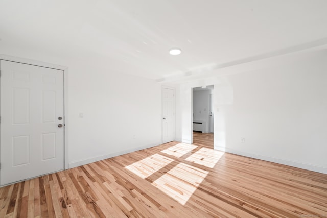 unfurnished room featuring light hardwood / wood-style floors