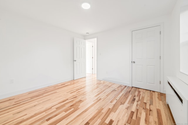 unfurnished bedroom with light hardwood / wood-style floors