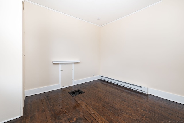 unfurnished room featuring hardwood / wood-style flooring and a baseboard radiator