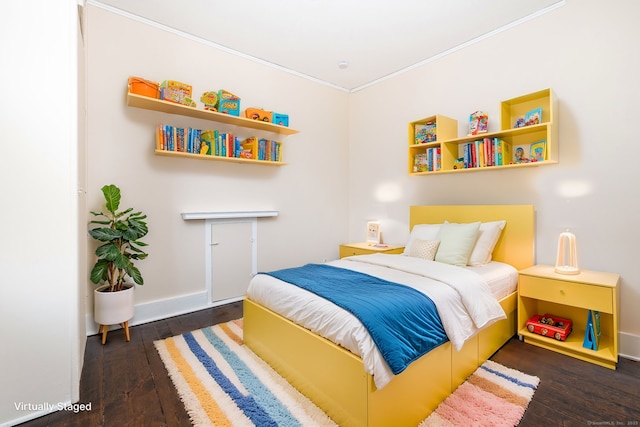 bedroom with dark hardwood / wood-style flooring