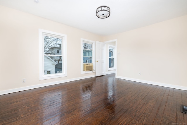 empty room featuring dark wood-type flooring