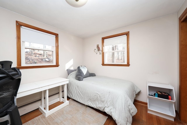 bedroom with hardwood / wood-style flooring