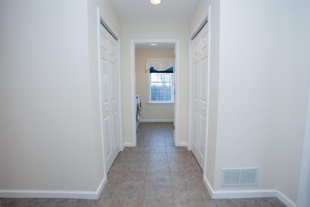 corridor featuring washer / clothes dryer