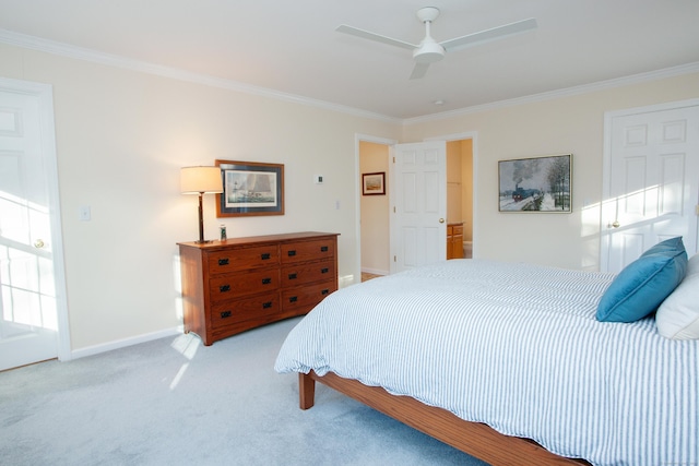 bedroom with ceiling fan, light colored carpet, and ornamental molding