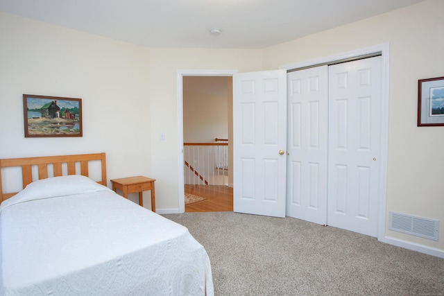 bedroom featuring carpet and a closet