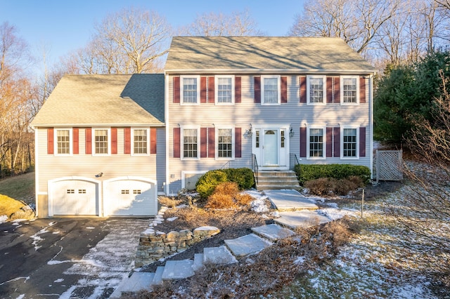 colonial inspired home with a garage