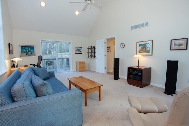 carpeted living room featuring ceiling fan and high vaulted ceiling