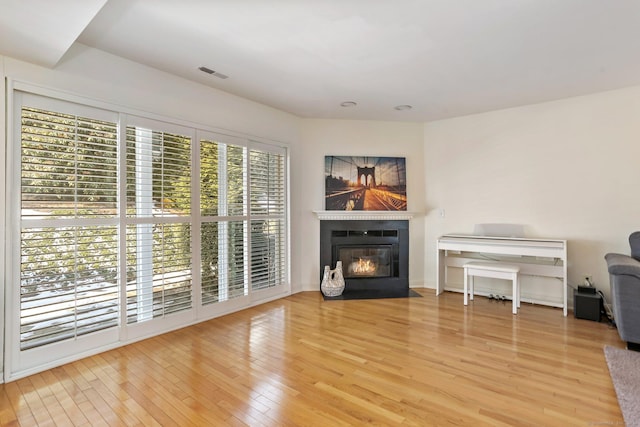 unfurnished living room with hardwood / wood-style flooring