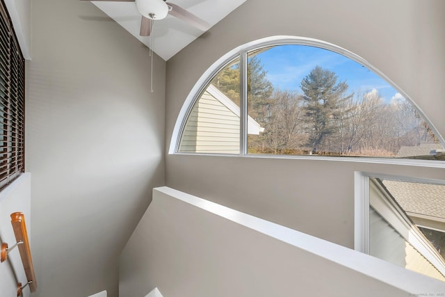 hallway featuring lofted ceiling