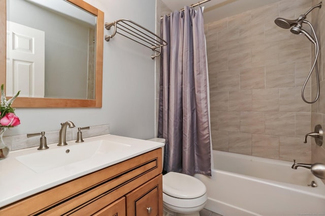 full bathroom featuring shower / bath combo, vanity, and toilet