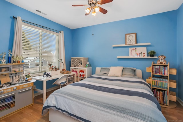 bedroom featuring ceiling fan and light hardwood / wood-style flooring