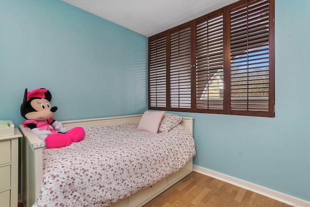 bedroom with light hardwood / wood-style flooring