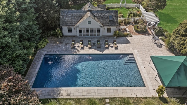 view of swimming pool featuring a patio area