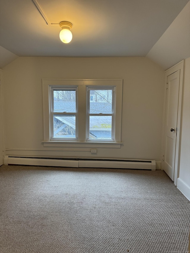 additional living space featuring a healthy amount of sunlight, carpet floors, and vaulted ceiling