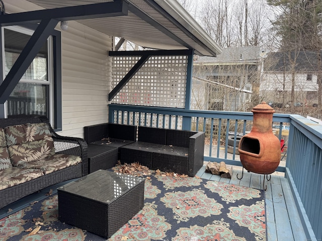 wooden deck featuring an outdoor hangout area