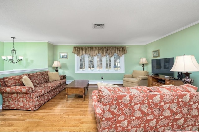 living room featuring a baseboard radiator, an inviting chandelier, ornamental molding, and light hardwood / wood-style flooring