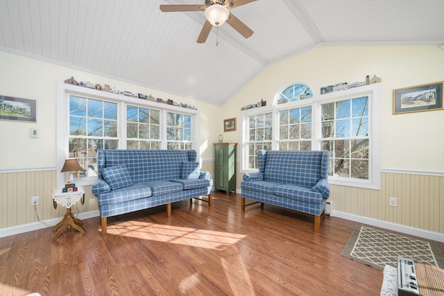 interior space featuring ceiling fan, wood-type flooring, lofted ceiling, and ornamental molding