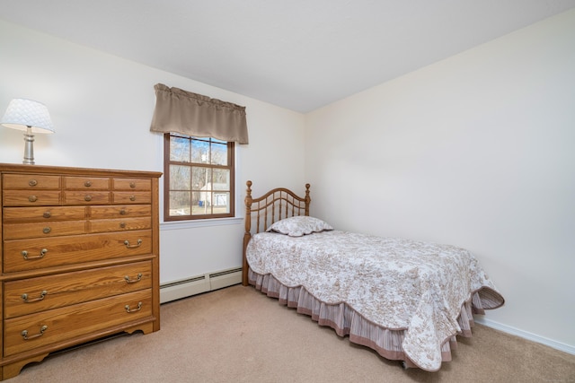 carpeted bedroom with a baseboard heating unit