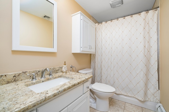 bathroom featuring baseboard heating, tile patterned flooring, vanity, and toilet