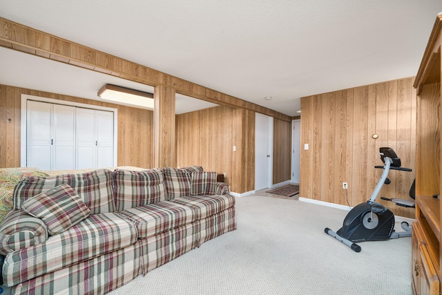 living room featuring light colored carpet and wooden walls