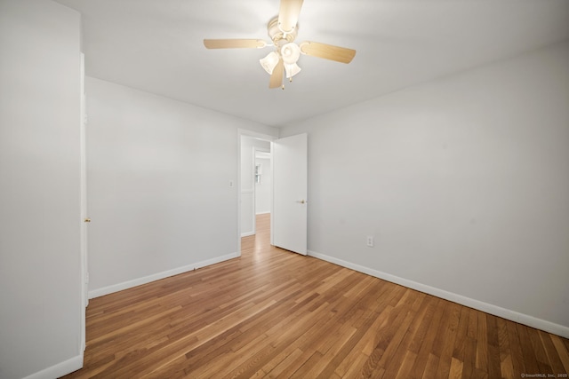 unfurnished room featuring ceiling fan and hardwood / wood-style flooring