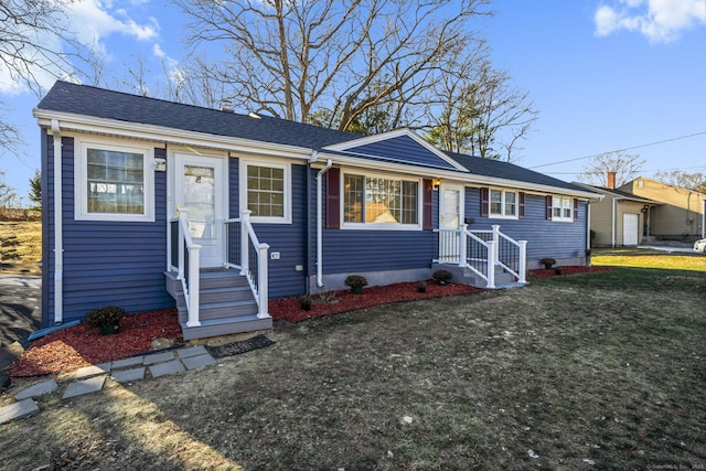 ranch-style house with a front lawn