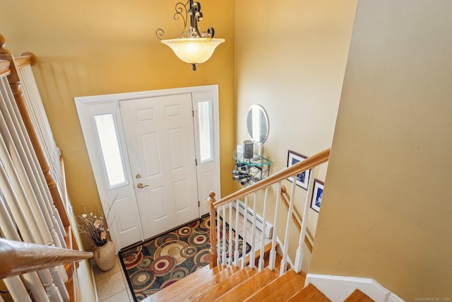 tiled entrance foyer featuring a baseboard heating unit