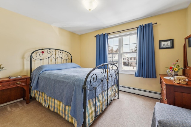 bedroom with carpet floors and baseboard heating