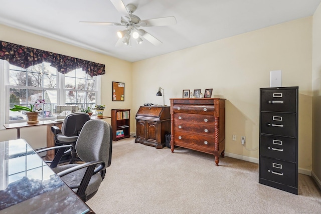 office featuring ceiling fan and light carpet