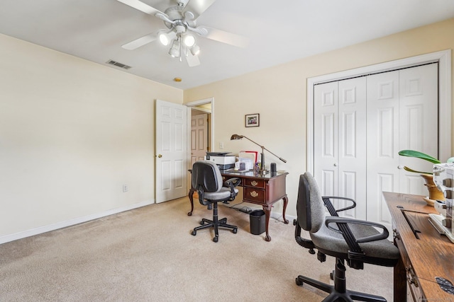 office featuring light carpet and ceiling fan