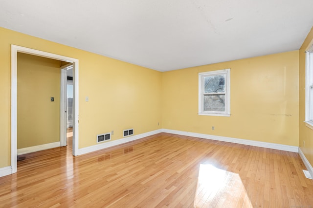 spare room with light wood-type flooring