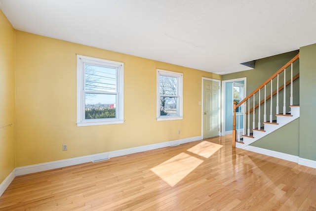 entryway with hardwood / wood-style flooring