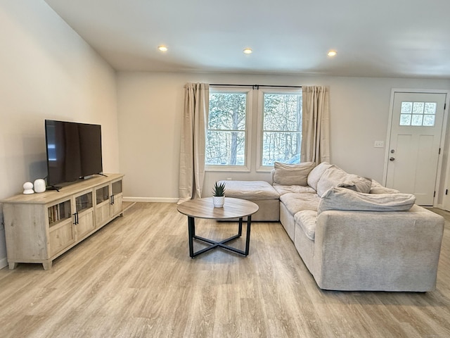 living room with light hardwood / wood-style flooring