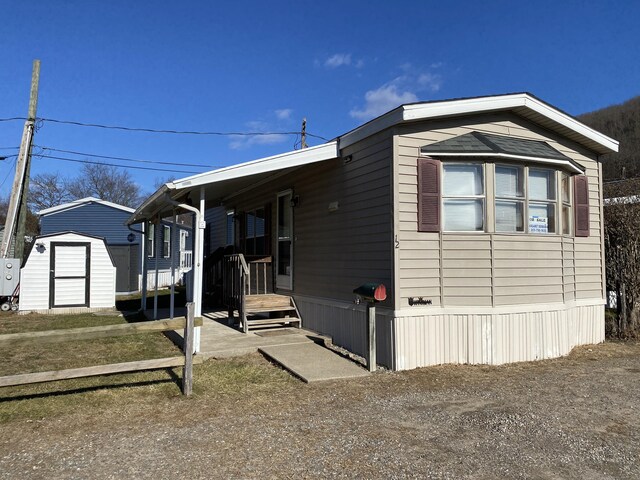 view of property exterior featuring a shed