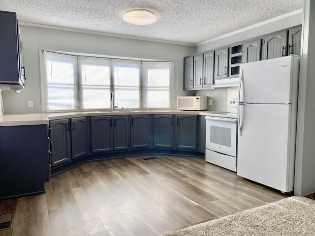 kitchen featuring sink, crown molding, a textured ceiling, light wood-type flooring, and white appliances