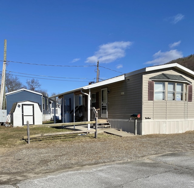 manufactured / mobile home with a shed