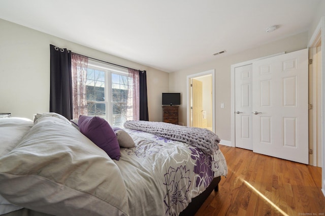 bedroom with wood-type flooring