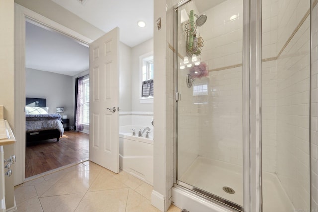 bathroom featuring tile patterned floors and plus walk in shower