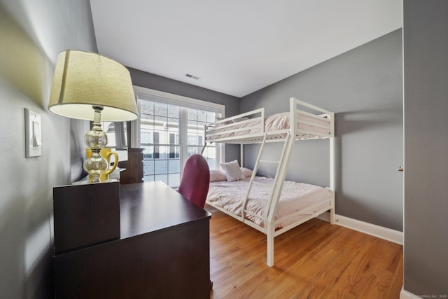 bedroom featuring wood-type flooring