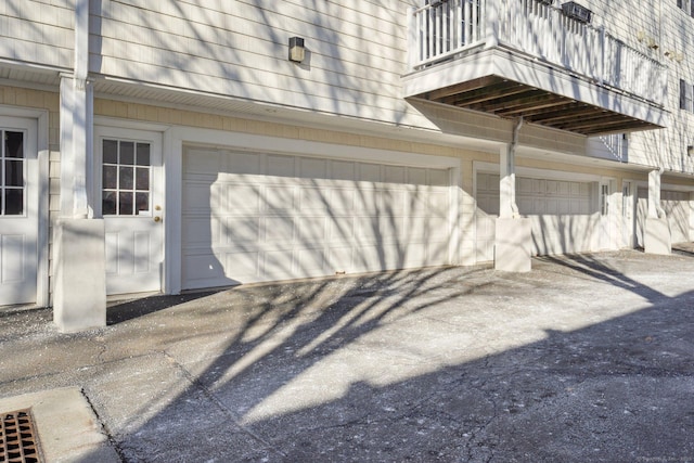 exterior space featuring a balcony and a garage